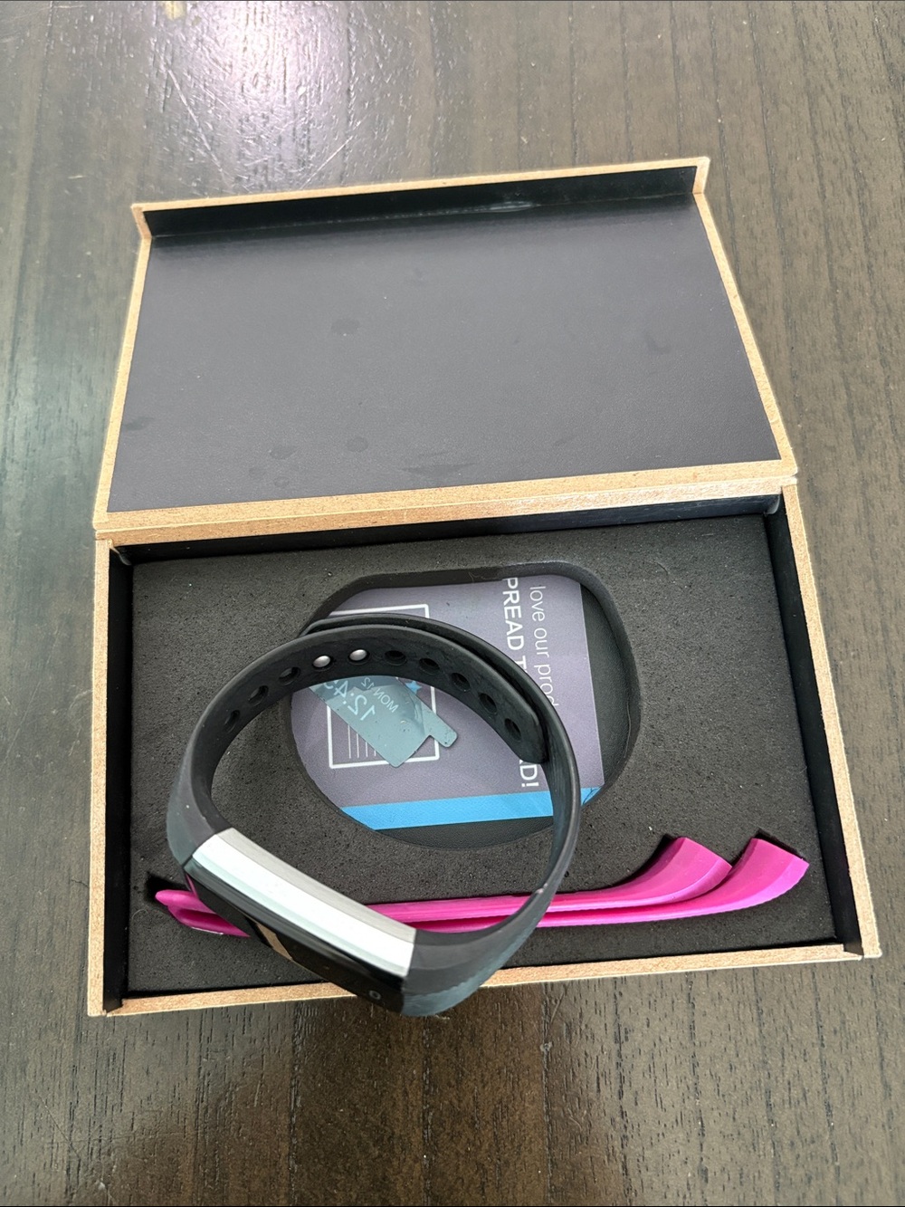 Black Fitness Tracker with Interchangeable Pink Accent Bands